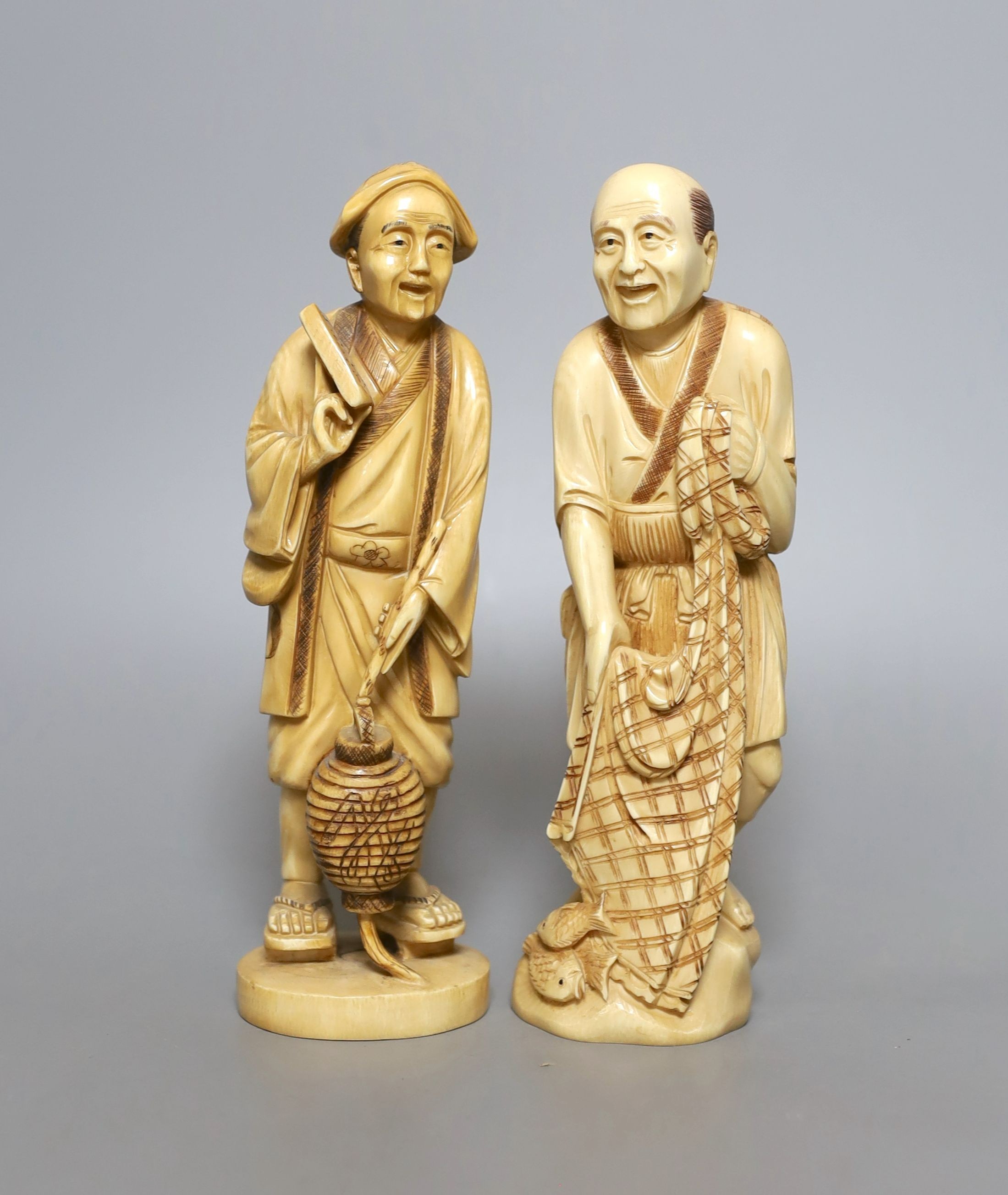 Two Japanese ivory okimono figures of a fisherman and another, marked to base, early 20th century - tallest 21cm